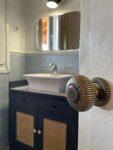 a bathroom with a sink and a mirror at San Bartolome Etxea 1 in Ea