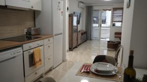 a kitchen with a table with a plate on it at Apartamento Altea Centro in Altea