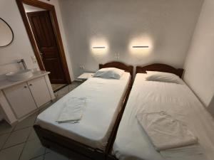 Postel nebo postele na pokoji v ubytování Maria Eleni Guesthouse