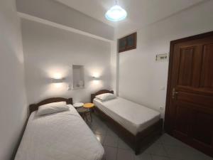 Postel nebo postele na pokoji v ubytování Maria Eleni Guesthouse