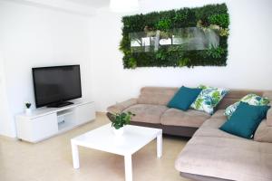 Et tv og/eller underholdning på Villa Belén playa , piscina privada