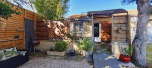 a house with potted plants in front of it at La Chambrette in Salon-de-Provence