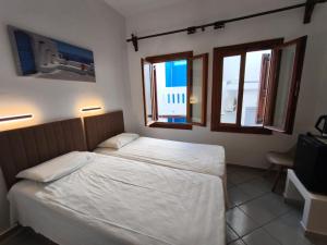 Postel nebo postele na pokoji v ubytování Maria Eleni Guesthouse