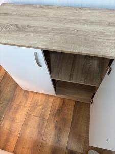 a wooden table with a drawer in a room at Fenice in Trieste