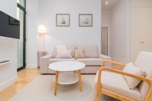 a living room with a couch and a table at Vivienda en el Sardinero in Santander