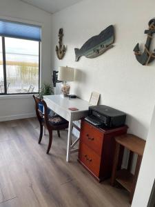 an office with a desk with a printer and a window at The Lake House on Lake Rosalie in Lake Wales +31 photos