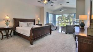 a bedroom with a bed and a living room at 411 Mariners Club in Key Largo +37 photos