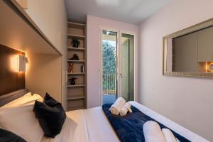 Ένα ή περισσότερα κρεβάτια σε δωμάτιο στο Duomo Design - Bilocale-Wifi-Aircon