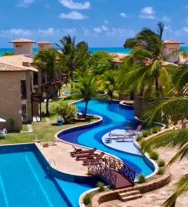 una vista de la piscina del resort en Pipa Paradise Vista Piscina 500m da Praia do Amor, en Pipa