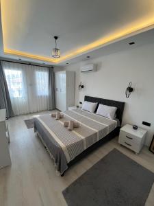 a bedroom with a large bed in a room at Villa PALA in Kemer