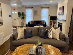 a living room with a couch and a fireplace at 3 br Spacious Home in Ideal Location w Free Parking Back Yard Pets Welcome in Chicago