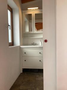 a bathroom with a sink and a mirror at Bodega Linda in Puntagorda +28 photos