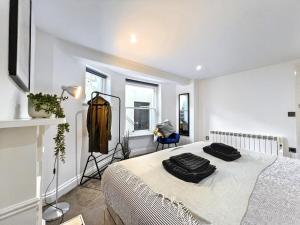 a bedroom with a bed and a mirror in it at The Beach Garden Flat in Brighton & Hove