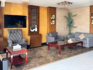 a living room with couches and a coffee table at Quiet Rooms 12 in Riyadh