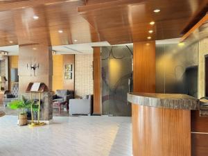 a lobby with a bar in a building at Quiet Rooms 12 in Riyadh
