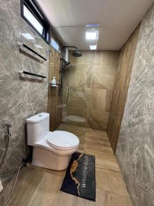 a bathroom with a toilet and a shower at Rinda House in Patong Beach +17 photos