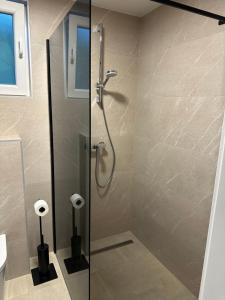 a shower with a glass door in a bathroom at Apartment Medjugorje in Međugorje