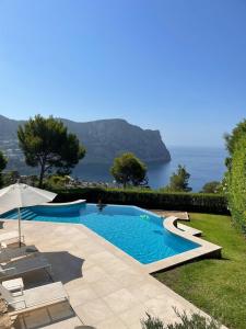 a swimming pool with a view of the ocean at Villa with amazing sea views in Port d’Andratx