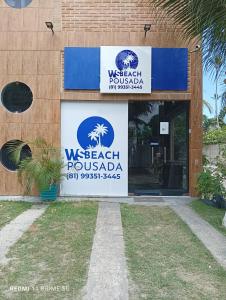 a sign on the front of a building at WS Beach Pousada in Porto De Galinhas