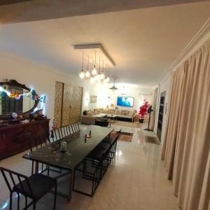Gallery image of Two pools four bedrooms private villa in Qaryat Shākūsh +13 photos