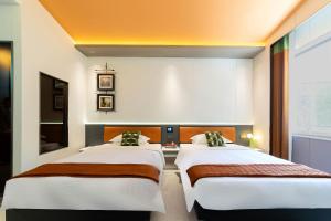 Vishan Keys Hotel 维尚潮宿客房内的一张或多张床位
