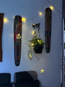 a room with two snowboards hanging on a wall at Hostel Madras in Chennai