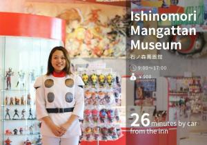 a woman is standing in a toy store at Hotel El faro in Onagawa