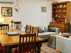 a living room with a table and a couch at Cottage Bliss on Moonta Main St in Moonta