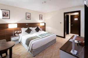 Ένα ή περισσότερα κρεβάτια σε δωμάτιο στο Landmark Darkm Hotel Makkah