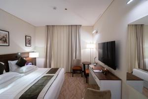 Ένα ή περισσότερα κρεβάτια σε δωμάτιο στο Landmark Darkm Hotel Makkah
