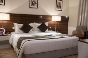 Ένα ή περισσότερα κρεβάτια σε δωμάτιο στο Landmark Darkm Hotel Makkah