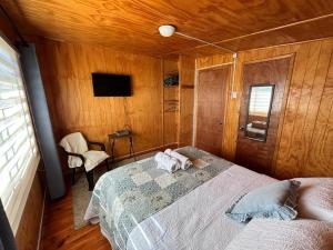 a bedroom with a bed with a towel on it at hospedaje mi casa in La Unión