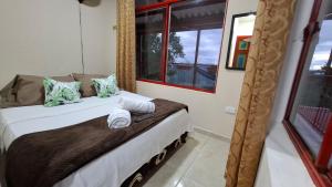 Postel nebo postele na pokoji v ubytování New Paradise Nueva Sede - La Vega Cundinamarca