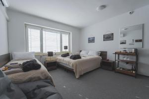 Postel nebo postele na pokoji v ubytování DO AVTA Rooms