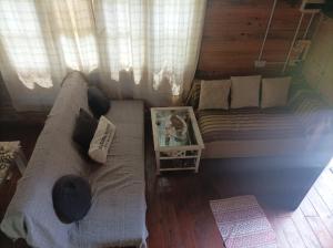 a bedroom with a large bed and a window at A LO DE MARY cabañas Isla Tigre in Tigre