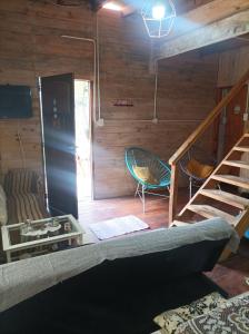 a living room with a bunk bed and a staircase at A LO DE MARY cabañas hospedaje in Tigre