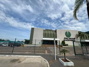 a building with a cannabis growing sign on it at Flat Presidencial Vivence Hotel in Palmas