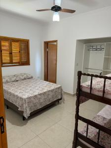 Ένα ή περισσότερα κρεβάτια σε δωμάτιο στο Casa de Campo Refúgio do Sol, Vista para o Pôr do Sol da Serra do Moquém