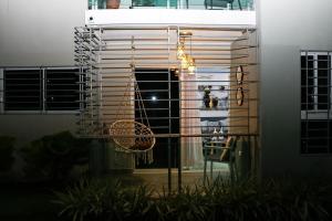a balcony with a table and a chair in a building at Lux 3BR Oasis With Gazebo & Pool in Pontezuela Arriba