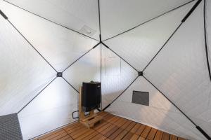 a room with a tv in a tiled wall at Tida Sesoko in Motobu