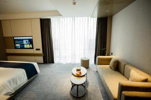 Χώρος καθιστικού στο Golden Tulip Jinzhou Central Street