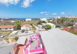 an aerial view of a town with a pink building at Da Pink And White Palace in Nassau