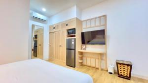Postel nebo postele na pokoji v ubytování Jambuluwuk Residence Blok M + 33 fotografií
