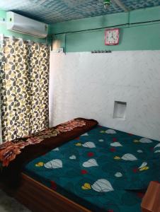 Katil atau katil-katil dalam bilik di Narsingh Sadan Home Stay