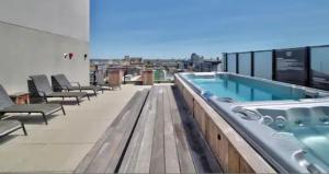 a large swimming pool on the roof of a building at INCh in Montréal
