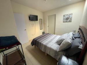 Postel nebo postele na pokoji v ubytování Casa Huésped Amparán
