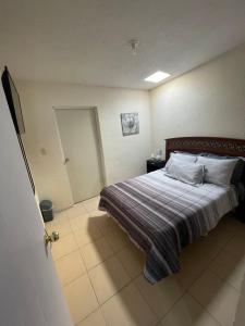 Postel nebo postele na pokoji v ubytování Casa Huésped Amparán
