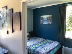 Postel nebo postele na pokoji v ubytování Wahapo Lodge