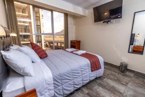 Postel nebo postele na pokoji v ubytování Hotel Sky Mirador