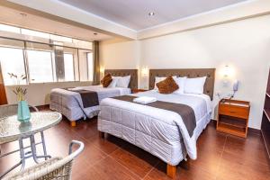 Postel nebo postele na pokoji v ubytování Hotel Sky Mirador